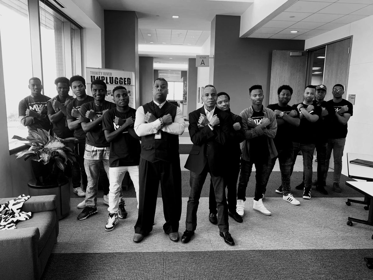 President Obama walking with MBK students at the White House, marking the program's national origins